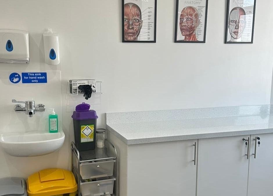 Hygienic treatment room at Simply Glow Aesthetics in Bathgate, Scotland, GB, showcasing spotless surfaces.