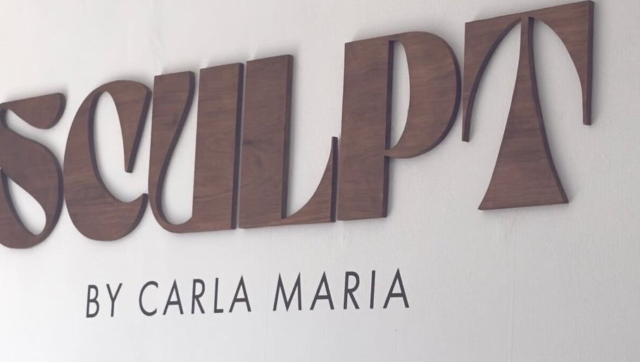Sculpt sign at ByCarlaMaria in Sutton Coldfield, England, GB, featuring elegant wood lettering.