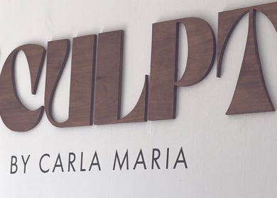 Sculpt sign at ByCarlaMaria in Sutton Coldfield, England, GB, featuring elegant wood lettering.