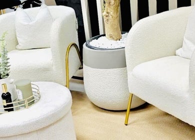 Chic seating area at FaceFIT With Lauren, Inverness, Scotland, GB featuring white chairs and a modern table.
