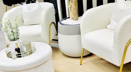 Chic seating area at FaceFIT With Lauren, Inverness, Scotland, GB featuring white chairs and a modern table.