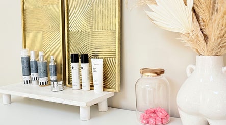 FaceFIT With Lauren skincare products on display in Inverness, Scotland, GB with golden decor.