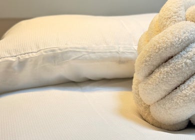 Luxurious white pillow and throw at FaceFIT With Lauren, Inverness, Scotland, GB, enhancing relaxation.