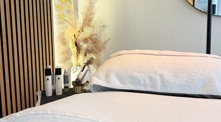 Relaxing treatment room at FaceFIT With Lauren in Inverness, Scotland, GB, featuring cozy bedding and beauty products.