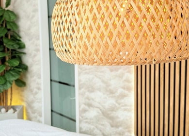 Relaxing spa atmosphere at FaceFIT With Lauren, Inverness, Scotland, GB, featuring a wicker lamp and plant.