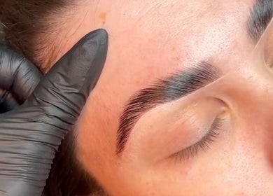 Expert brow shaping at Hausofbeauty_brows, Nottingham, England, GB, enhancing a client's natural beauty.
