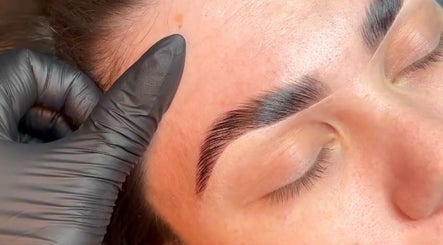 Expert brow shaping at Hausofbeauty_brows, Nottingham, England, GB, enhancing a client's natural beauty.