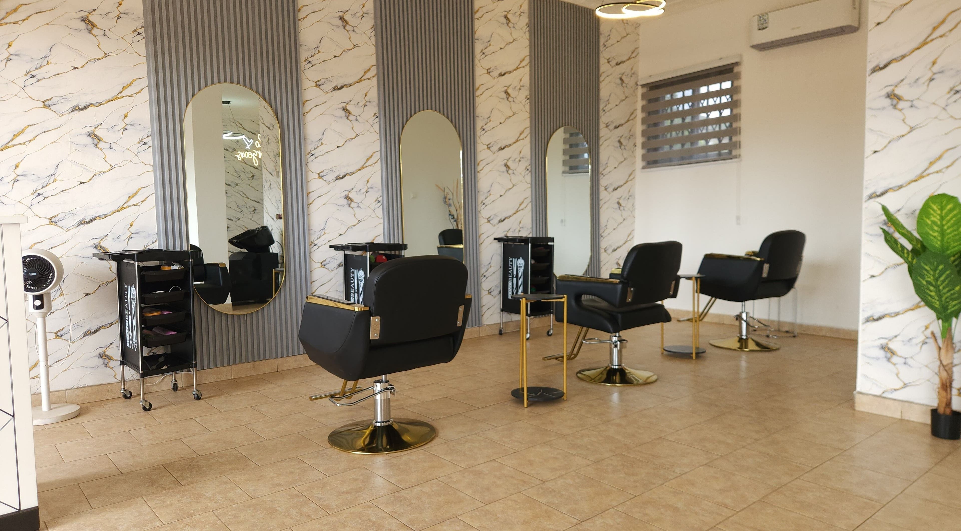 Elegant salon at Ash Hair Story, Accra, Greater Accra Region, GH with modern design and stylish chairs.