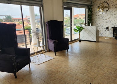 Elegant salon interior at Ash Hair Story, Accra, Greater Accra Region, GH with plush chairs and stylish decor.