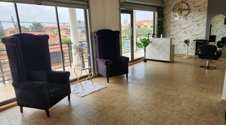 Elegant salon interior at Ash Hair Story, Accra, Greater Accra Region, GH with plush chairs and stylish decor.