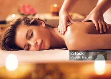 Relaxing massage at Soi52 Thai Therapy in Leicester, England, GB with candles creating a peaceful atmosphere.