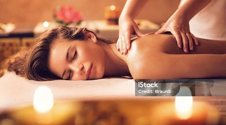 Relaxing massage at Soi52 Thai Therapy in Leicester, England, GB with candles creating a peaceful atmosphere.