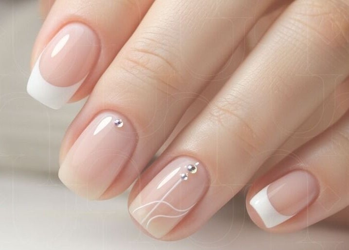 French manicure with gems at Piu Nail Spa, Riyadh, Riyadh Province, SA.