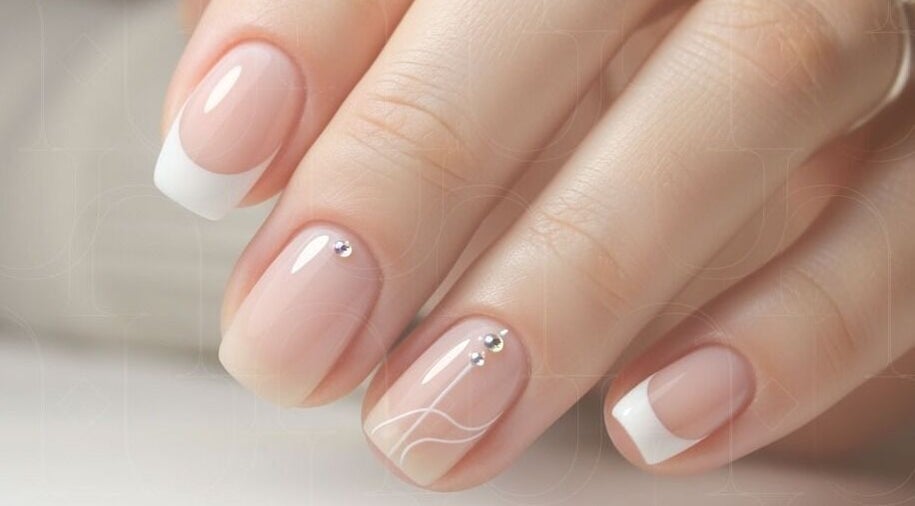 French manicure with gems at Piu Nail Spa, Riyadh, Riyadh Province, SA.