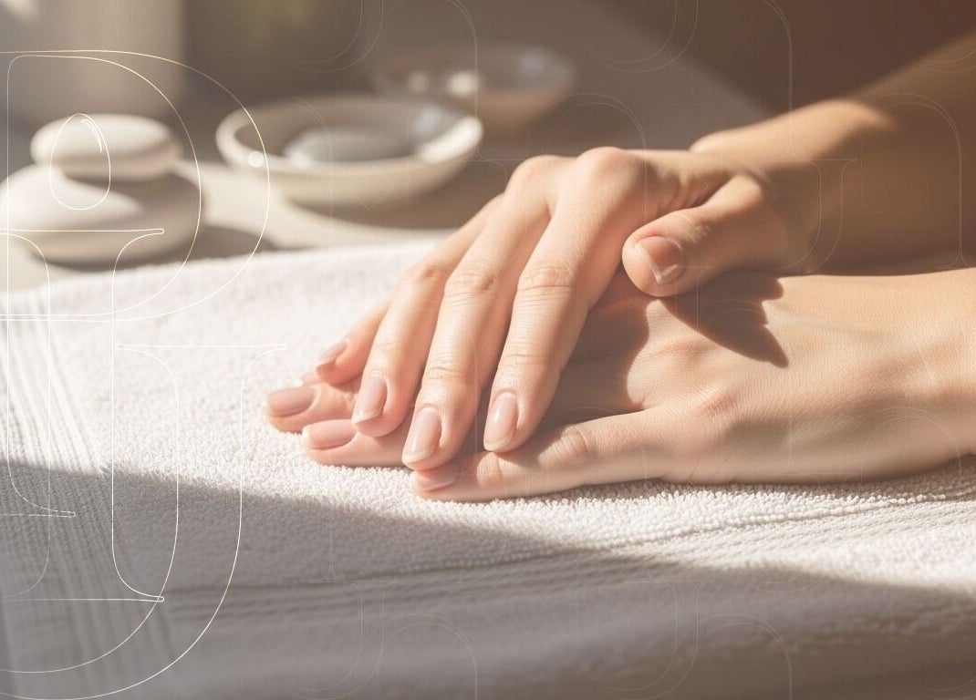 Relaxed hands on towel at Piu Nail Spa, Riyadh. Experience wellness at Riyadh Province, SA.