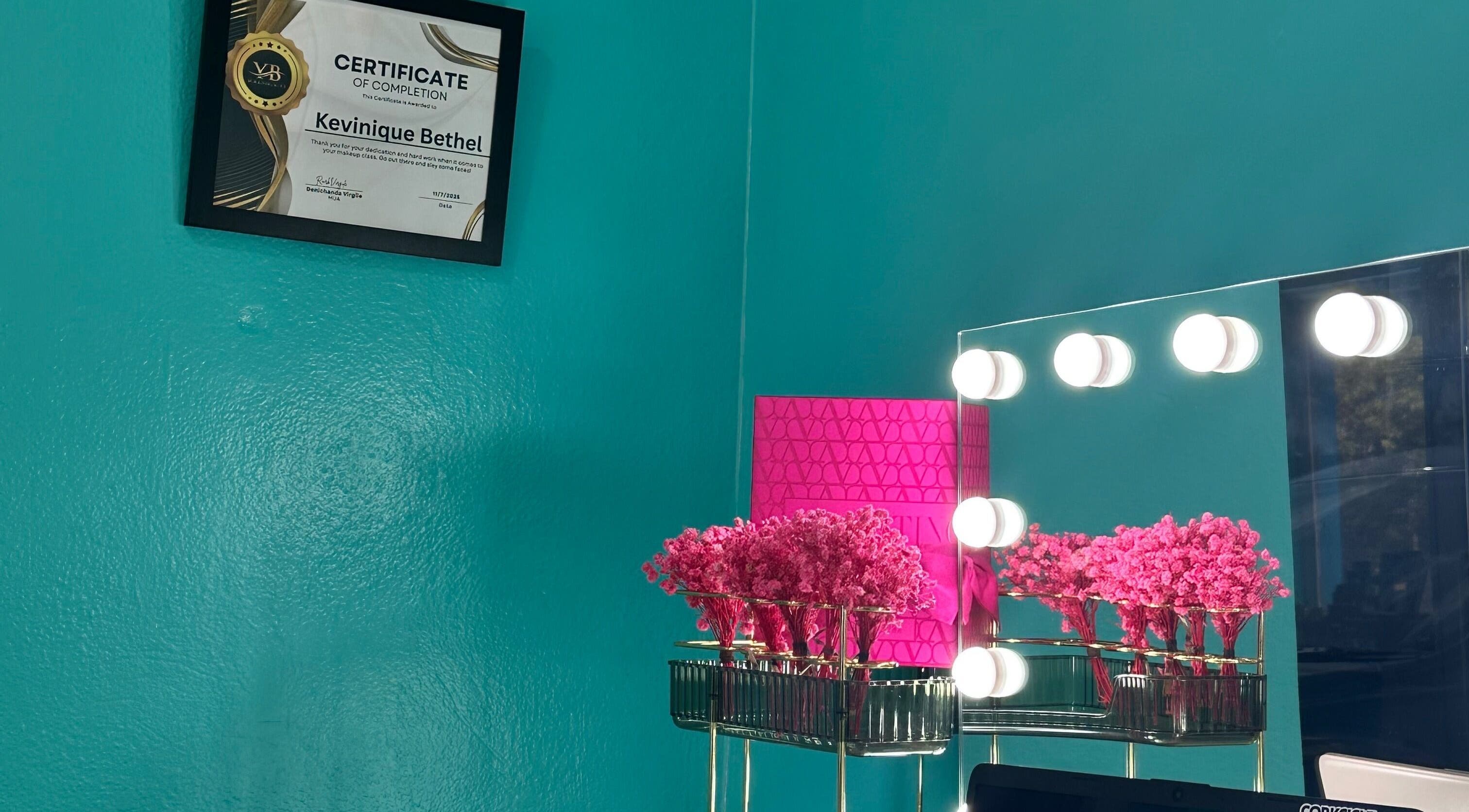 Elegant vanity setup at Hair Infirmary242, Nassau, New Providence, BS, featuring a mirror with lights and decor.