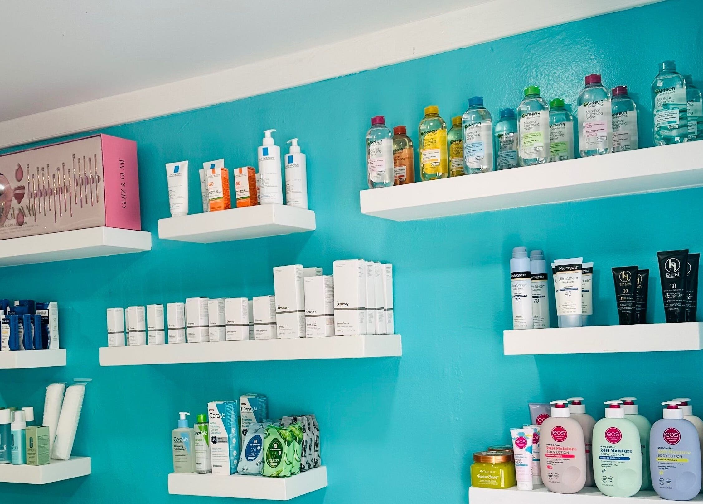 Diverse skincare products on shelves at Hair Infirmary242, Nassau, New Providence, BS.
