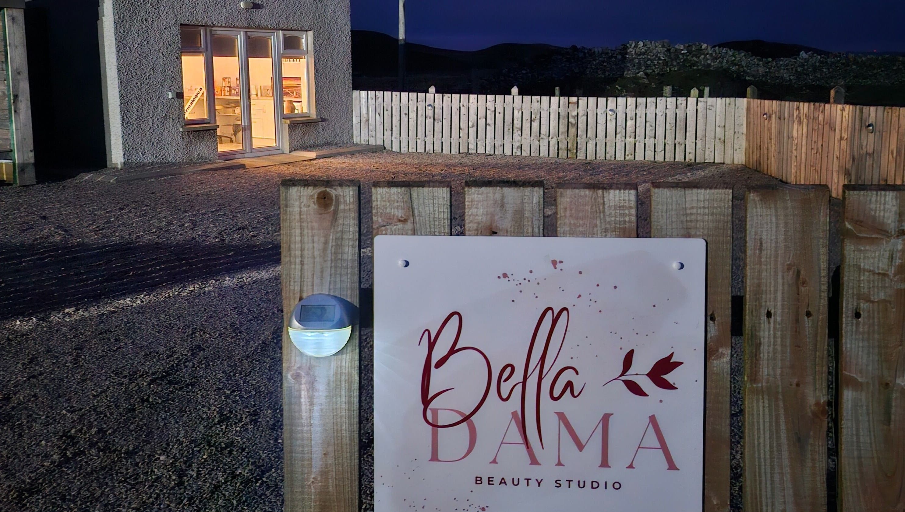 Bella Dama Beauty Studio entrance sign in County Donegal, County Donegal, IE, warmly lit in the evening.