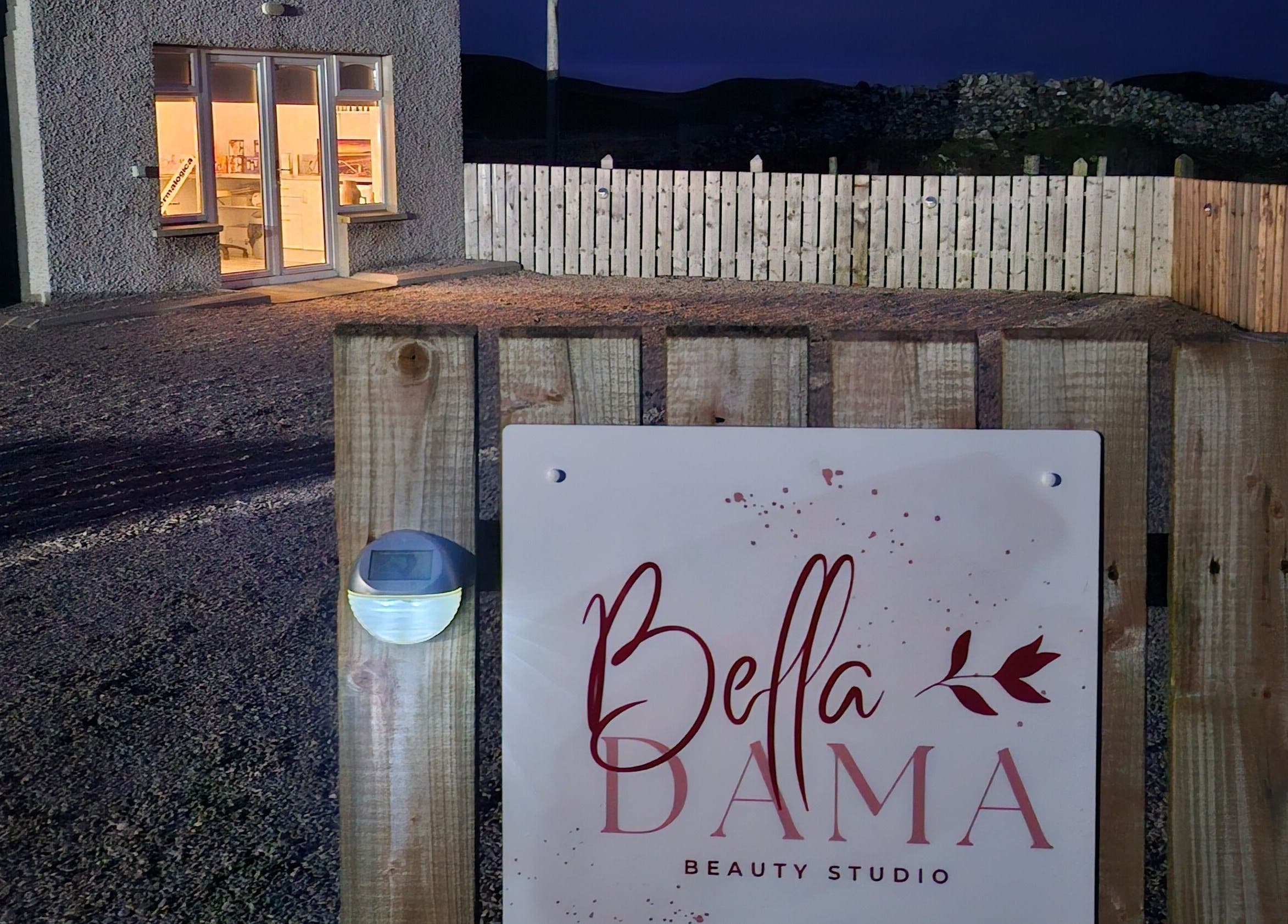 Bella Dama Beauty Studio entrance sign in County Donegal, County Donegal, IE, warmly lit in the evening.