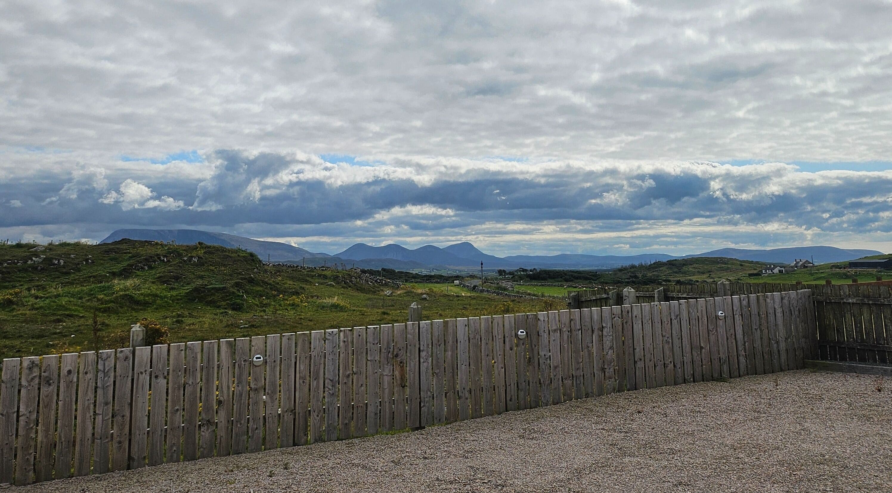 Scenic view from Bella Dama Beauty Studio, County Donegal, IE, featuring lush hills and a serene sky.