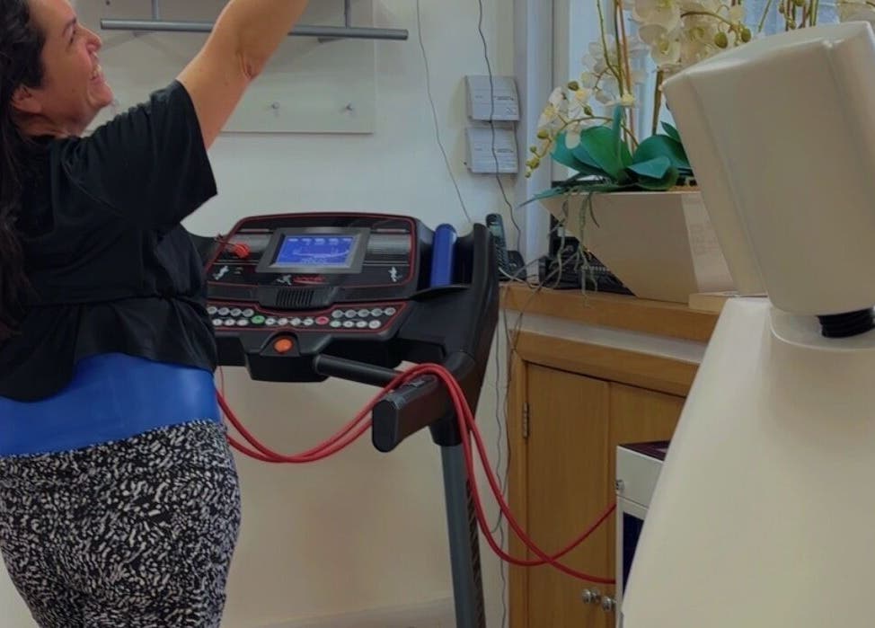 Woman using exercise equipment at Hypoxi Slim Suite, Ascot, England, GB.