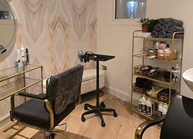 Cozy interior at Sama London Hair Studio located in London, England, GB, featuring stylish salon equipment.