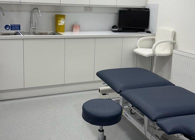 Modern therapy room at Elite Medical, Sports Therapy and Ear Care, Shaw, England, GB, equipped with treatment table.