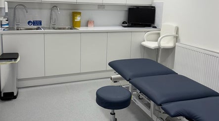 Modern therapy room at Elite Medical, Sports Therapy and Ear Care, Shaw, England, GB, equipped with treatment table.