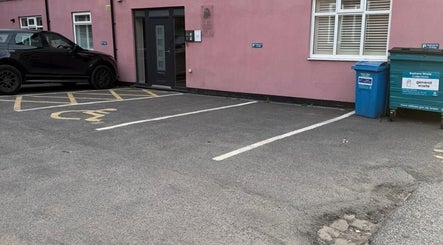 Entrance and accessible parking at Elite Medical, Sports Therapy and Ear Care, Shaw, England, GB.