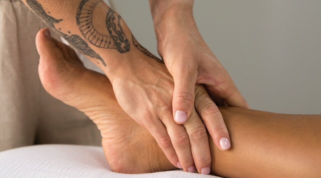 Therapist performing a soothing foot massage at Lymph by Camila, Lisbon, Lisbon, PT.