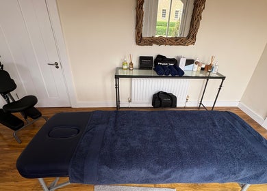 Relaxing massage room at SRSportsRehab, Silverstone, England, GB with treatment table and soothing decor.