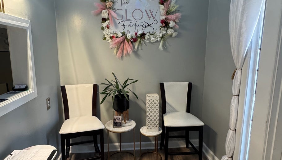 Elegant waiting area at The Glow Factory, Columbia, South Carolina, US with floral decor and seating.