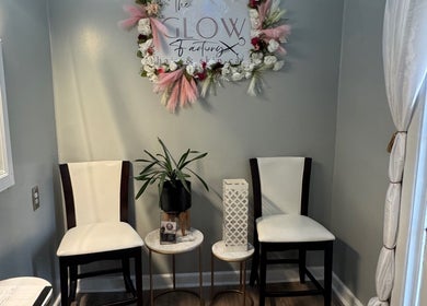 Elegant waiting area at The Glow Factory, Columbia, South Carolina, US with floral decor and seating.