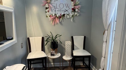 Elegant waiting area at The Glow Factory, Columbia, South Carolina, US with floral decor and seating.