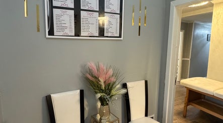 Seating area with elegant decor and service list at The Glow Factory, Columbia, South Carolina, US.