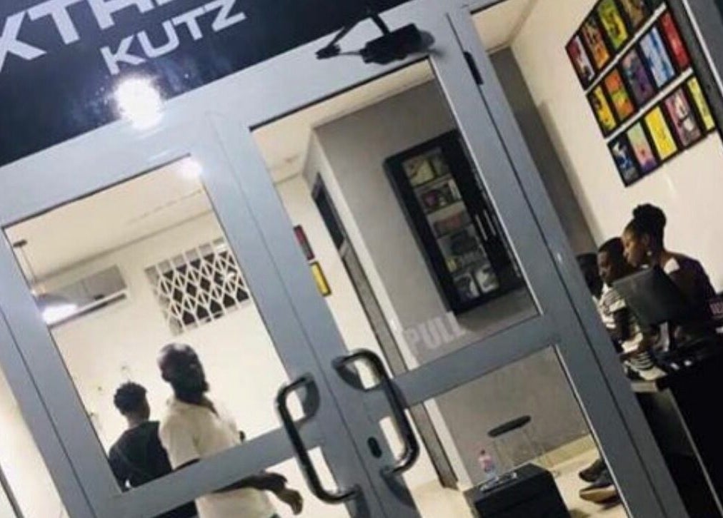 Front view of Xtreme Group salon in Accra, Greater Accra Region, GH, with people inside.