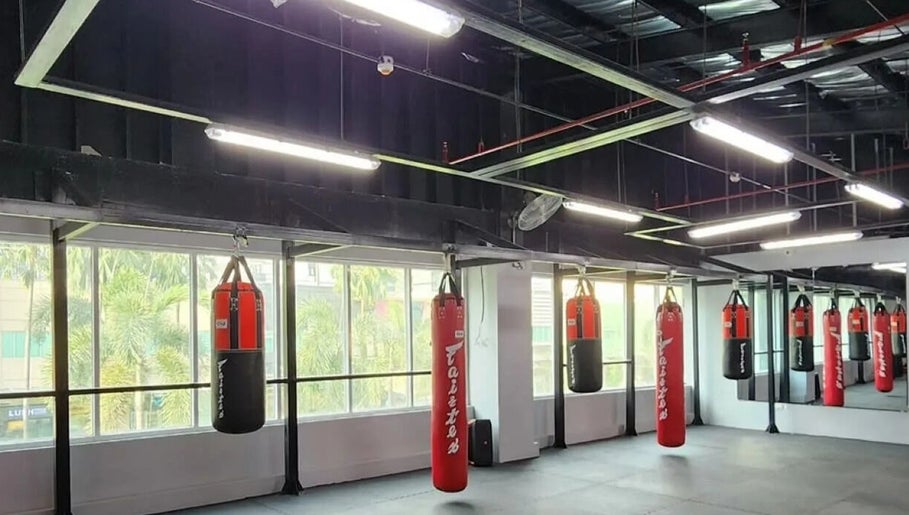 Red punching bags at The Lab Boxing & Muay Thai gym - Bonifacio High Street, Metro Manila, PH.