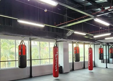 Red punching bags at The Lab Boxing & Muay Thai gym - Bonifacio High Street, Metro Manila, PH.