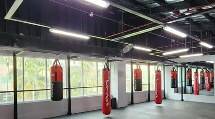 Red punching bags at The Lab Boxing & Muay Thai gym - Bonifacio High Street, Metro Manila, PH.