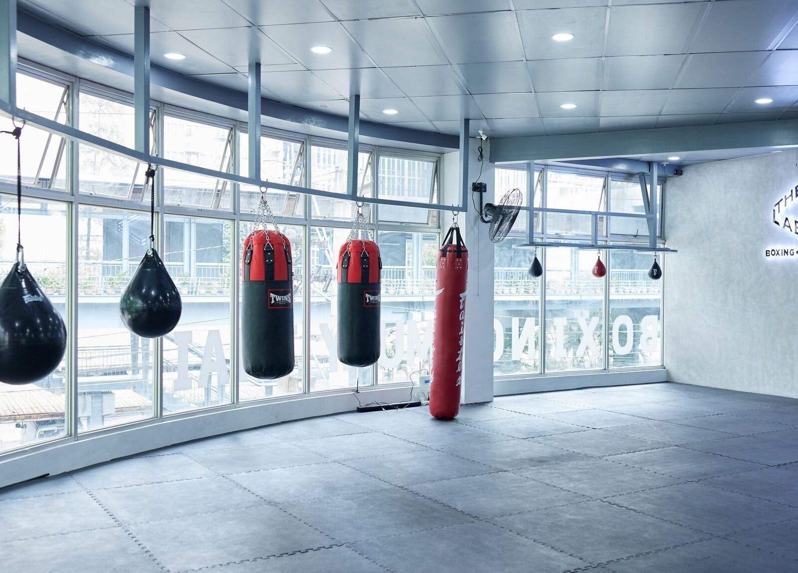 Spacious training area with punching bags at The Lab Boxing & Muay Thai gym - MAKATI, Makati City, Metro Manila, PH.