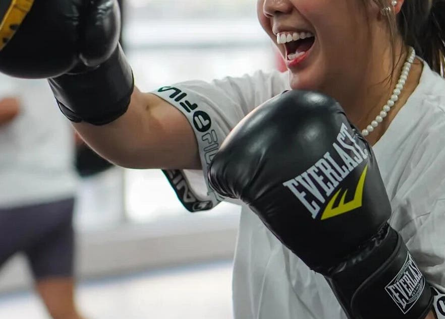 Woman enjoying a boxing session at The Lab Boxing & Muay Thai gym - MAKATI, Makati City, Metro Manila, PH.