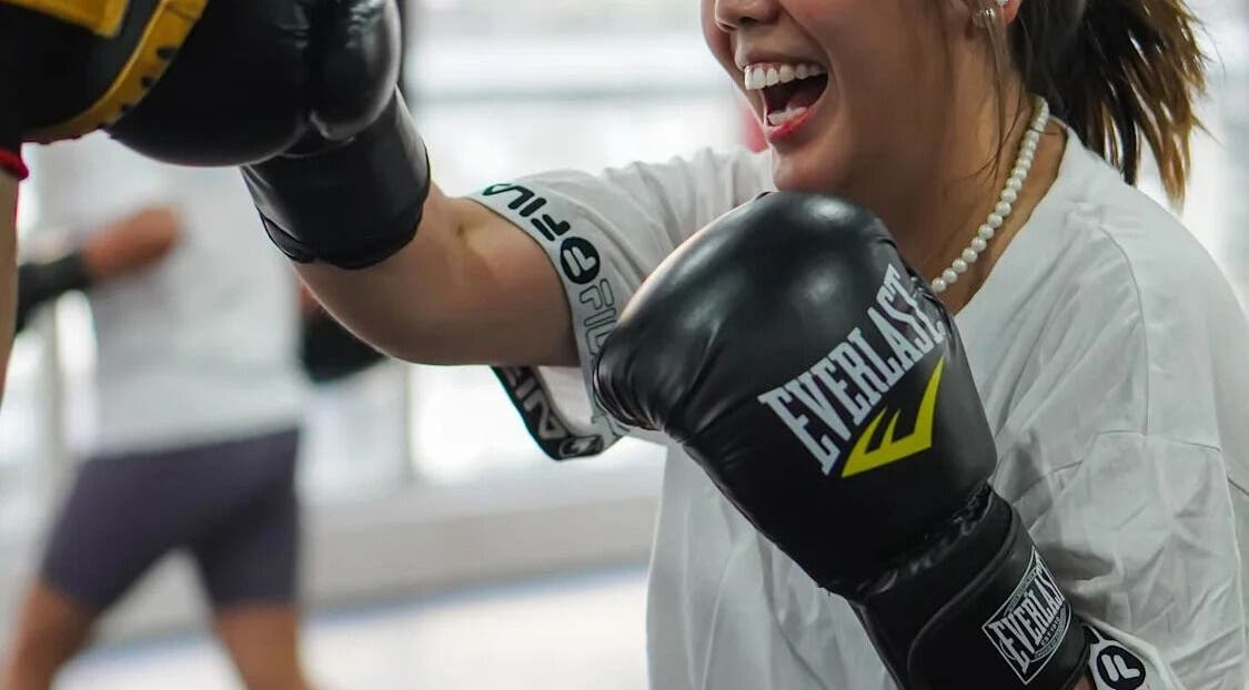 Woman enjoying a boxing session at The Lab Boxing & Muay Thai gym - MAKATI, Makati City, Metro Manila, PH.