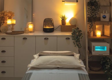 Cozy massage room at Endless Massage Therapy in London, England, GB with warm lighting and soothing decor.