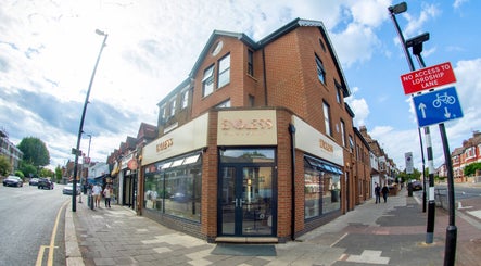 Endless Massage Therapy on a vibrant street corner in London, England, GB with elegant brick facade.