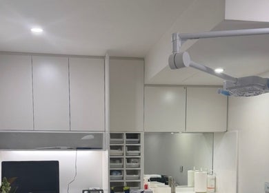 Modern treatment room at Beautified by Mads, Neutral Bay, New South Wales, AU with sleek cabinets and lighting.