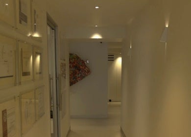 Elegant hallway at Beautified by Mads, Neutral Bay, New South Wales, AU, featuring art and certifications.
