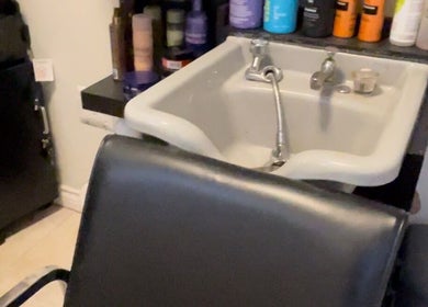 Hair By Khatool's sleek wash station in St. Catharines, Ontario, CA, showcasing modern salon elegance.