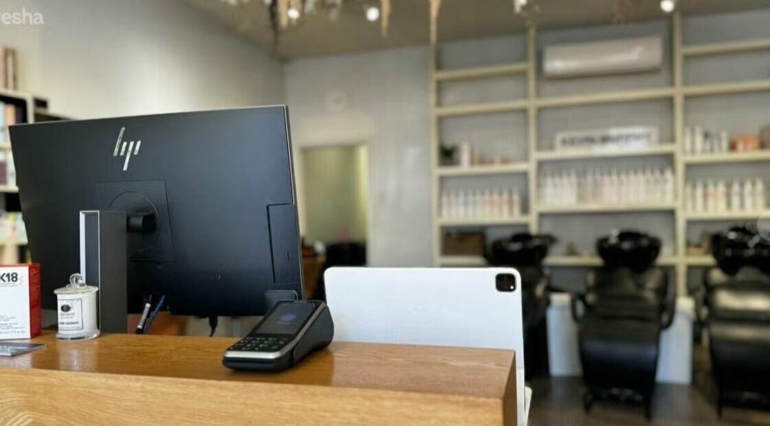 Reception area of Nivarna Hair Studio in Springwood, New South Wales, AU, with stylish salon decor.