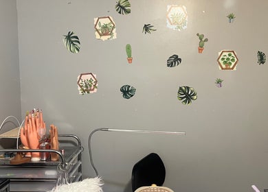 Creative nail art setup at Gelxnailsbydiana_92 in Justice, Illinois, US with decorative plant wall accents.