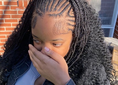 Woman with intricate braids at Dreams Vanity, Philadelphia, Pennsylvania, US showcasing hairstyling expertise.